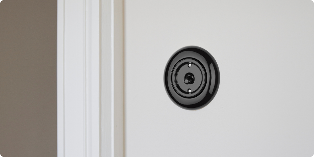 Ronde wip schakelaar zwart porselein klassiek retro